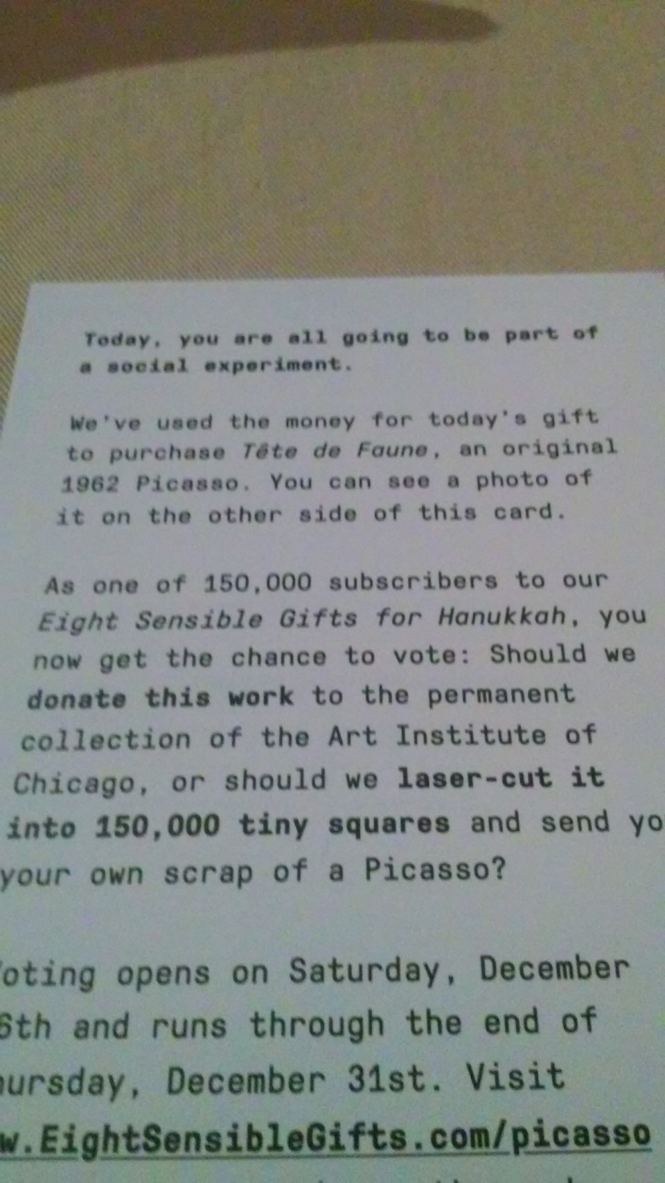 If you can't read this, it basically says that they used the money to buy an original Picasso, and you have to go to this website to vote whether to donate it to an art museum or cut it into 150,000 tiny squares.