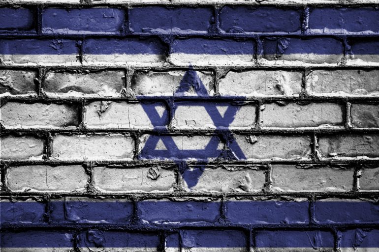 Blue Stripe Top and Bottom with Blue Star of David in Middle painted on Grey Brick